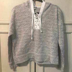 Cropped hooded sweatshirt. Size medium. Lace up